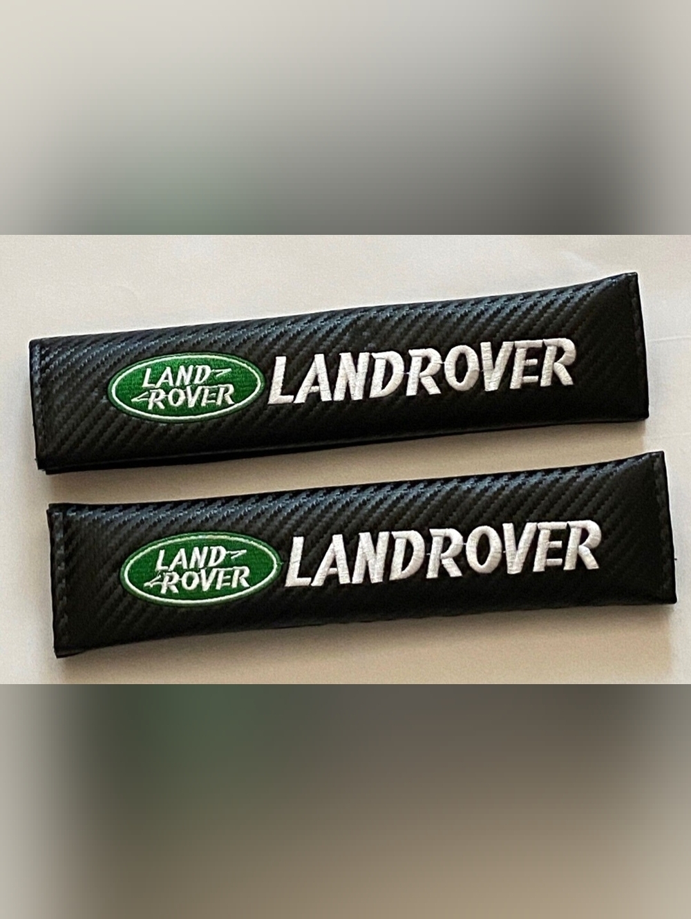 Two new Land Rover Carbon Seat belt shoulder pads Covers